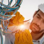 Electrician,Working,With,Cable,On,The,Construction,Site,house,And,House
